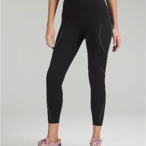 Lululemon Base Pace High-Rise Reflective Tight in classic black, Size 4. 25 in
